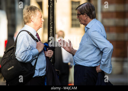 London, UK. 23 July, 2019. Guests including Bill Cash (r), Conservative MP for Stone, leave after attending a celebration in Westminster of Boris Johnson’s election as Conservative Party leader and replacement of Theresa May as Prime Minister organised by the pro-Brexit European Research Group (ERG). Credit: Mark Kerrison/Alamy Live News Stock Photo