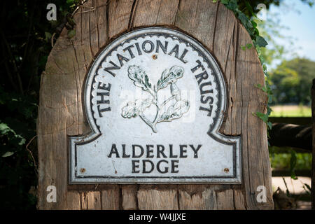 A sign indicates the entrance to National Trust land on the outskirts of the small town of Alderley Edge in Cheshire, UK. Stock Photo