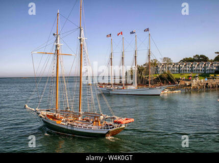Bar Harbor, Maine, USA. 7th Sep, 2005. A two-masted sailing ship sails past the 4-masted schooner Margaret Todd, that takes tourists on sightseeing trips, anchored in Bar Harbor, Maine, with the Bar Harbor Inn in background. Credit: Arnold Drapkin/ZUMA Wire/Alamy Live News Stock Photo