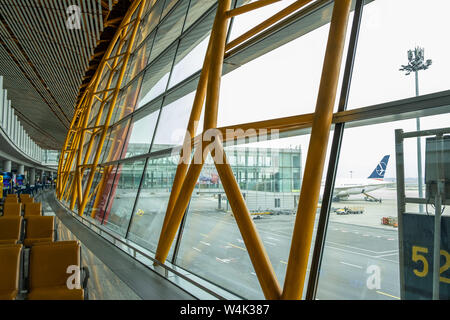 Beijing, China - June 17, 2019: Looking out of the airport window at international departures terminal Stock Photo