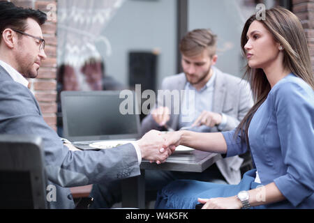 handshake business partners in an informal setting Stock Photo