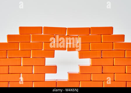White hole in brick wall. Frame of Toy block in shape of brick Stock Photo