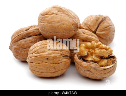 Whole and cracked walnuts isolated on white background Stock Photo