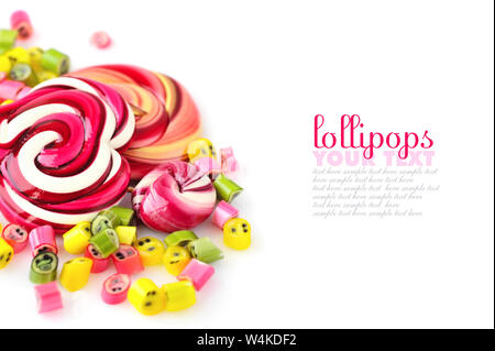 Colorful candies and lollipops on a white background with empty space Stock Photo