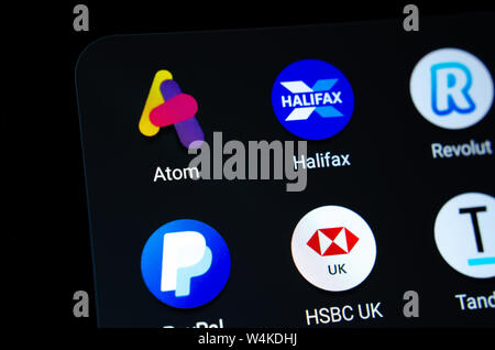 Atom bank app next to the other banking apps on the smartphone screen. Conceptual: mobile (virtual) bank competing with conventional high street banks Stock Photo