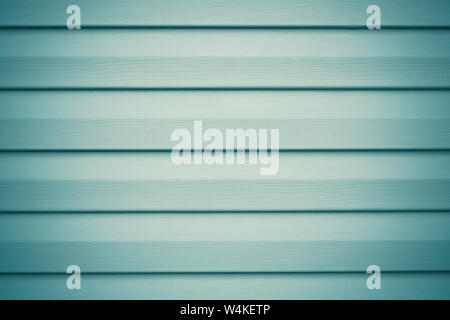 Light gray and green wood planks. Abstract blue background with metal horizontal stripes for decorative design. Wooden texture. Stock Photo