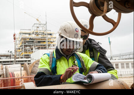 Tobolsk, Russia - May 29. 2018: Sibur company. Construction of plant on processing of hydrocarbons. Construction worker on a construction site check d Stock Photo