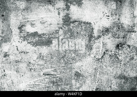 Gray and white concrete wall. Shabby dirty rough surface. Whitewash, old stucco. Cement texture, abstract background. Stock Photo