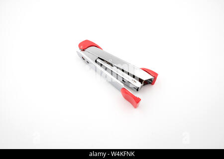 Silver pink stapler isolated on white background Stock Photo