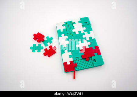 Creative soft silicone puzzle rainbow color notebook isolated on white background Stock Photo