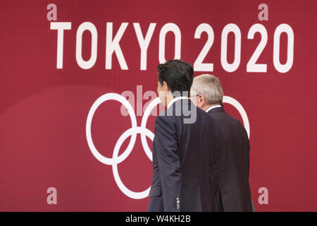 July 24, 2019 - Tokyo, Japan - Japanese Prime Minister Shinzo Abe and IOC President Thomas Bach walk past a Tokyo 2020 logo during the ''One Year to Go'' ceremony for the Tokyo 2020 Olympic Games. Organizers unveiled the Olympic medal design for the Tokyo 2020. The Games are set to open on July 24, 2020. (Credit Image: © Rodrigo Reyes Marin/ZUMA Wire) Stock Photo
