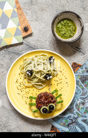 Cutlet spider with pesto pasta Stock Photo