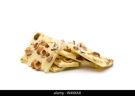 hazelnut white chocolate chunks on white background Stock Photo