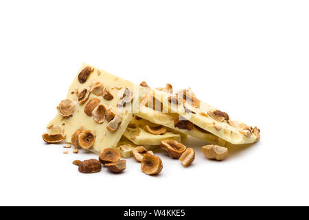 hazelnut white chocolate chunks on white background Stock Photo