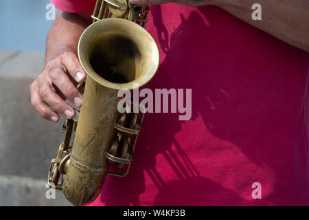 Musician hands while playing saxophone detail Stock Photo