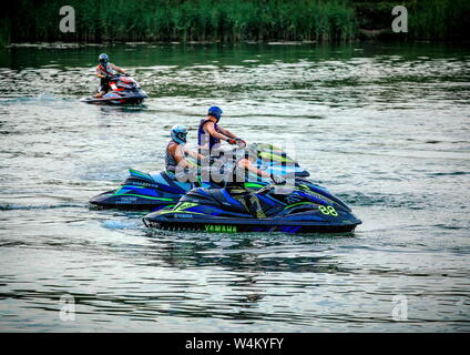 06 28 2009 Russia, Bryansk. Competition. Pilots saddled their jet skis and are waiting for the fourth participant. Stock Photo