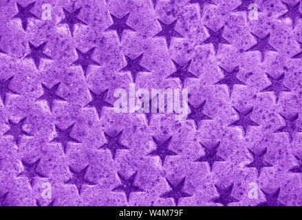 Lots of little purple stars on metallic purple background. Stock Photo