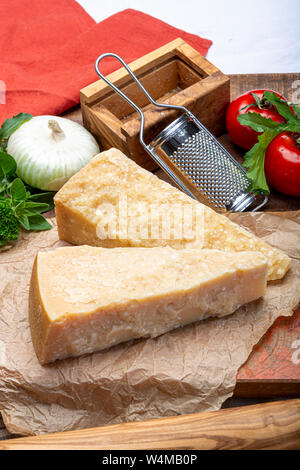 Cheese collection, Italian original aged Parmesan cheese in two pieces close up Stock Photo