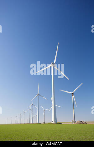 Wind turbines in Holland producing clean and sustainable energy to help against global warming Stock Photo