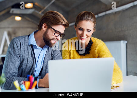 Two creative coworkers working together at the office Stock Photo