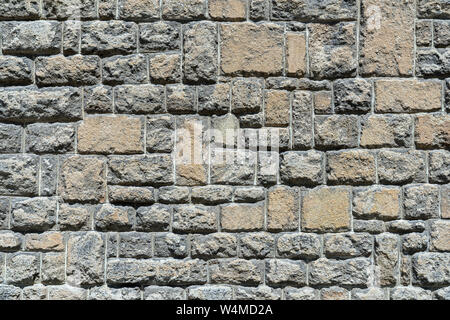 Old gray brown stone wall Stock Photo