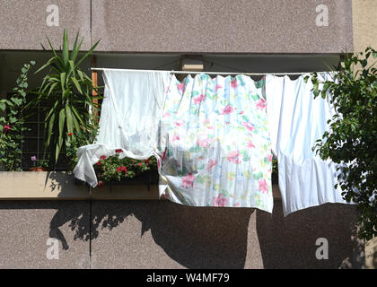 24 July 2019, Hessen, Frankfurt/Main: With cloths, residents protect the plants on the balcony and their home in Bornheim from the hot sun. Germany is facing a heat wave - and already on Wednesday this will be clearly noticeable in many areas. Photo: Arne Dedert/dpa Stock Photo