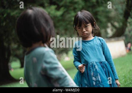 two little girls fighting over toys Stock Photo