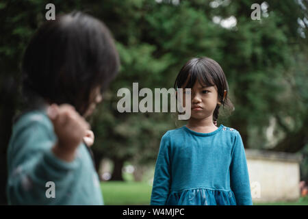 two little girls fighting over toys Stock Photo