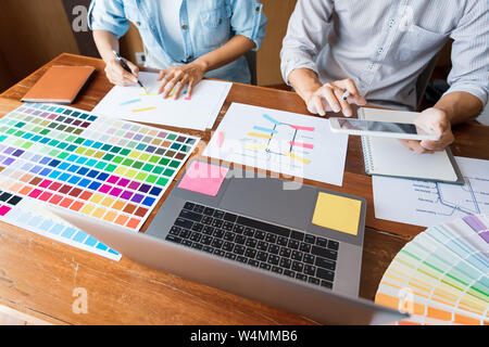 business technology concept, creative team designer choosing samples with UI/UX developing on sketch layout design mockup on smartphone application fo Stock Photo