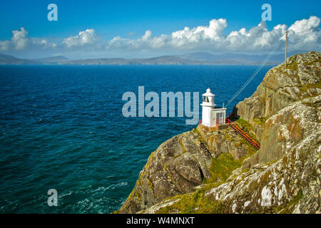 small white Lighthouse at the end of Sheeps Head Peninsula, West Cork, Irland Stock Photo