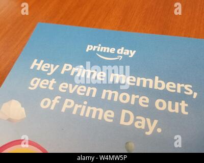 Close-up of logo for Amazon Prime Day sale on flyer announcing sale, on light wooden surface, July 12, 2019. () Stock Photo