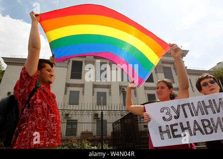 Ukrainian LGBT activists hold a LGBT flag during the protest.Protest demanding for a murder investigation of the Russian LGBT rights activist Yelena Grigoryeva outside the Russian Embassy in Kiev, Ukraine. According to the media a well-known LGBT rights activist Yelena Grigoryeva, 41, was found dead with multiple knife wounds in St Petersburg of Russia on Sunday, on 21 July 2019. Elena Grigorieva actively supported the women rights, the LGBT community, and went on pro-Ukrainian actions in Russia in support of Crimean Tatars and Ukrainian political prisoners. Stock Photo