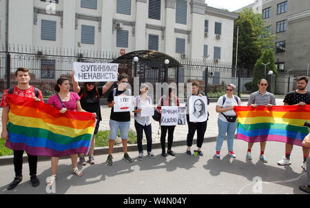 Ukrainian LGBT activists hold flags and placards during the protest.Protest demanding for a murder investigation of the Russian LGBT rights activist Yelena Grigoryeva outside the Russian Embassy in Kiev, Ukraine. According to the media a well-known LGBT rights activist Yelena Grigoryeva, 41, was found dead with multiple knife wounds in St Petersburg of Russia on Sunday, on 21 July 2019. Elena Grigorieva actively supported the women rights, the LGBT community, and went on pro-Ukrainian actions in Russia in support of Crimean Tatars and Ukrainian political prisoners. Stock Photo