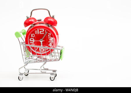alarm clock on mini cart on white background Stock Photo