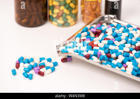 medical drug capsule on medical tray on white background Stock Photo