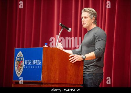 Three-quarter profile view of Donny Deutsch, marketing professional and television personality, speaking at a Milton S Eisenhower Symposium at the Johns Hopkins University, Baltimore, Maryland, November 9, 2010. From the Homewood Photography Collection. () Stock Photo