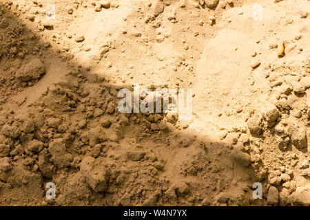 Yellow sand at beach with diagonal shadow Stock Photo