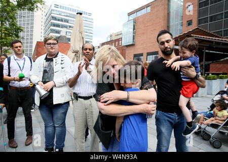 Manchester, UK, 24th July, 2019. The Mother and nephew of Yousef Makki at a peaceful protest. for the 17 year old  killed in a stabbing incident.  Family and friends feel let down by the justice system as nobody has been convicted of Yousef's murder.Crown Square Crown Court, Manchester, UK. Credit: Barbara Cook/Alamy Live News Stock Photo