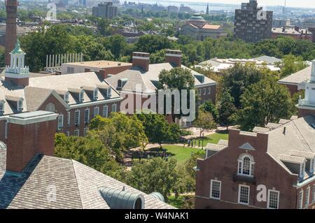 Bird's-eye view, on a sunny day, of a grassy quad and university buildings, with Baltimore and the Inner Harbor in the background, at the Johns Hopkins University, Baltimore, Maryland, September 4, 2006. From the Homewood Photography Collection. () Stock Photo