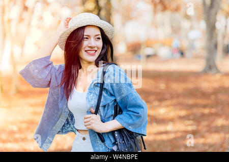 Asian girl teen in vacation holiday travel alone in autumn season Stock Photo