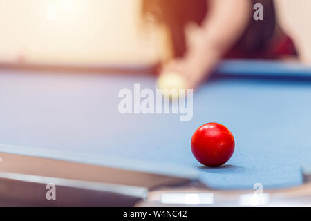 Playing Billiard or Pool Snooker Table closeup at red ball aim shot.Business target concept. Stock Photo