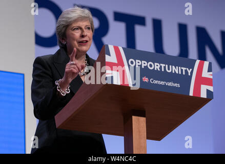 London, UK. 3rd Oct, 2018. File photo taken on Oct. 3, 2018 shows British Prime Minister Theresa May giving a speech during the Conservative Party annual conference 2018 in Birmingham, Britain. Newly-elected Conservative Party leader Boris Johnson took office as the British prime minister on Wednesday amid the rising uncertainties of Brexit. The latest development came after Theresa May formally stepped down as the leader of the country and Johnson was invited by the Queen to form the government. Credit: Han Yan/Xinhua/Alamy Live News