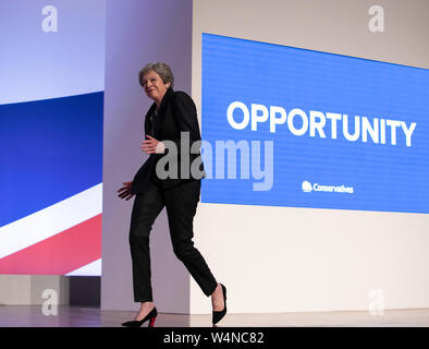 London, UK. 3rd Oct, 2018. File photo taken on Oct. 3, 2018 shows British Prime Minister Theresa May dancing to the stage to give a speech during the Conservative Party annual conference 2018 in Birmingham, Britain. Newly-elected Conservative Party leader Boris Johnson took office as the British prime minister on Wednesday amid the rising uncertainties of Brexit. The latest development came after Theresa May formally stepped down as the leader of the country and Johnson was invited by the Queen to form the government. Credit: Han Yan/Xinhua/Alamy Live News