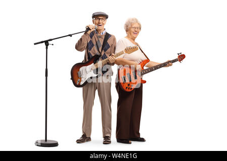 Full length portrait of senior musicians with electric guitar and a microphone isolated on white background Stock Photo