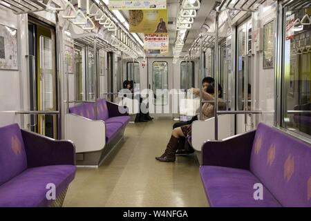 KYOTO, JAPAN - APRIL 15, 2012: Passengers ride Kyoto Municipal Subway train in Japan. Kyoto Subway operates since 1981 and has 31 stations. Stock Photo