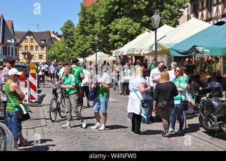 FURTH, GERMANY - MAY 6, 2018: Greuther Furth fans in green jerseys celebrate after soccer match in Furth, Germany. SpVgg Greuther Furth soccer club ex Stock Photo
