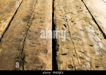 Close up of the old wooden table made from old wooden planks Stock Photo
