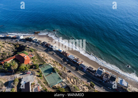 Aerial of beach homes along and above Pacific Coast Highway near Los Angeles in scenic Malibu California. Stock Photo