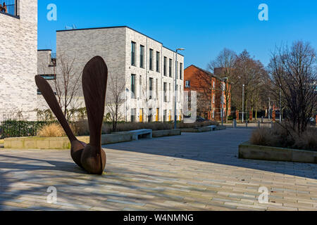 Sycamore Seed, a sculpture by Andrew McKeown, and Timekeepers Square town houses, off Chapel Street, Salford, Manchester, England, UK Stock Photo