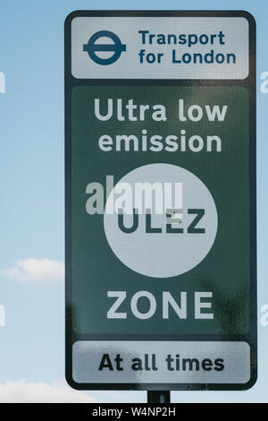 London, UK - July 15, 2019: Sign indicating Ultra Low Emission Zone (ULEZ) in London against blue sky and clouds. ULEZ was introduced in 2019 to help Stock Photo